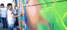 Más que pintura y color, paz y reconciliación en los muros de la Comuna 20