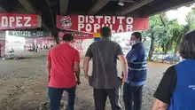 Mesa de Dialogo con voceros de barras del américa que llevan a cabo intervención de pintura en el puente de la calle 26 con autopista.