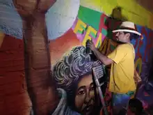 La comuna 20 fortalece el turismo coloreando la Calle de la Poesía