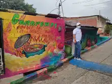 La comuna 20 fortalece el turismo coloreando la Calle de la Poesía