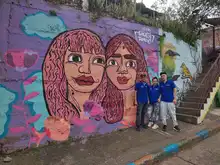 La comuna 20 fortalece el turismo coloreando la Calle de la Poesía