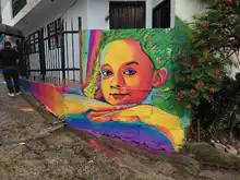 La comuna 20 fortalece el turismo coloreando la Calle de la Poesía